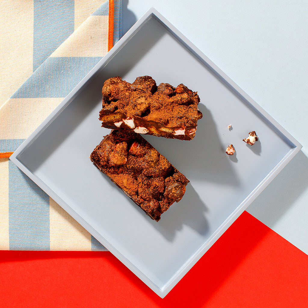 An overhead view of our Rocky Road traybake slices on a square grey plate