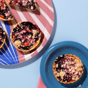 A serving suggestion of our delicious Blueberry Lemon Tarts - baked for coffeeshops so that you dont have to