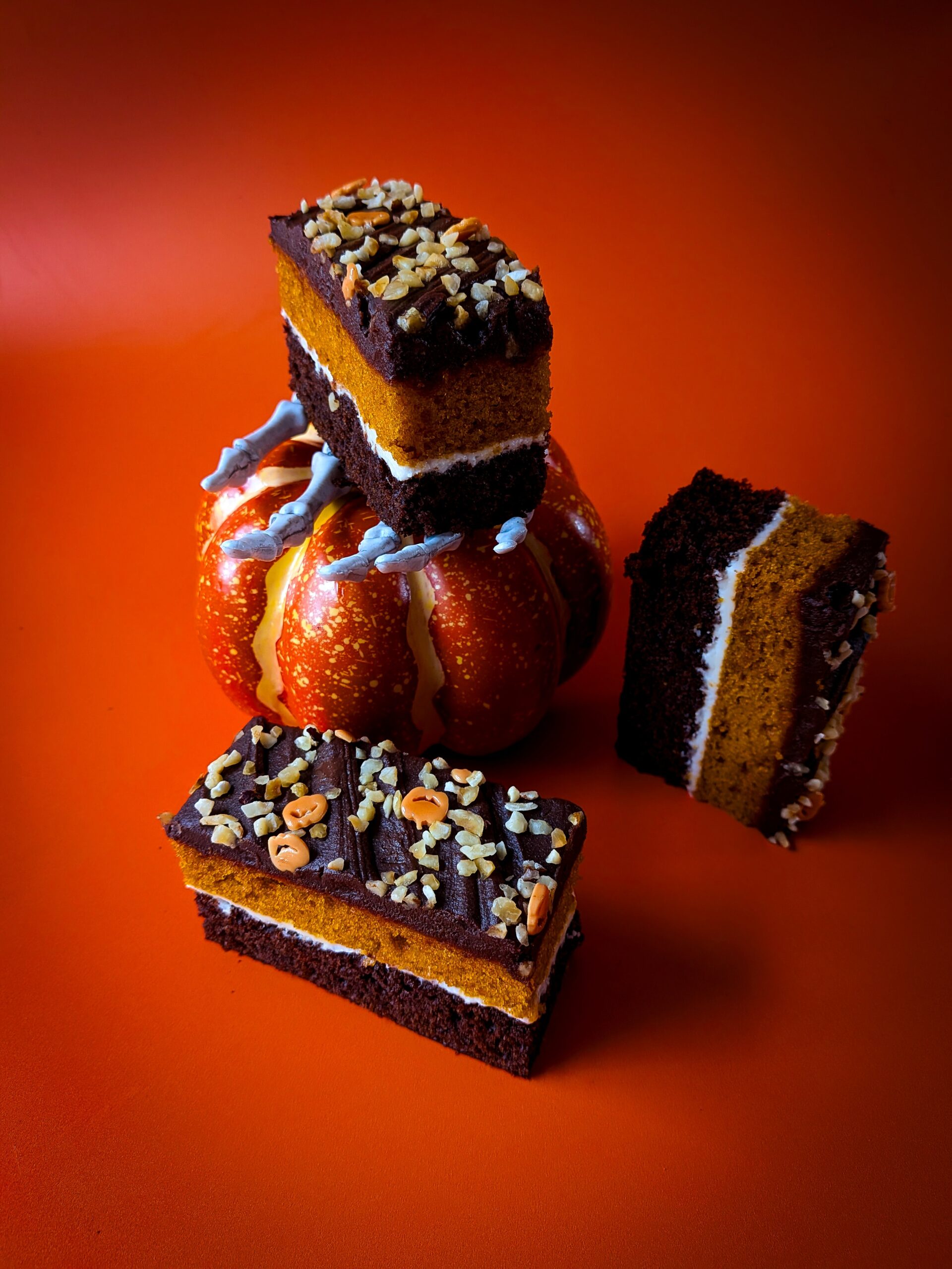 Close-up of chocolate praline pumpkin traycake slice showing praline layers – coffee shop cake supplier UK