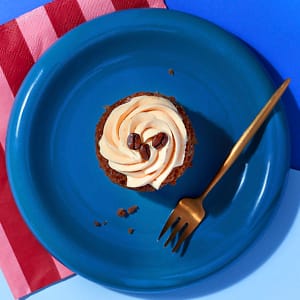 Overhead view of a Little Latte cupcake from CakeClub - a creamy frosting on top of a delicious coffee-flavoured treat.